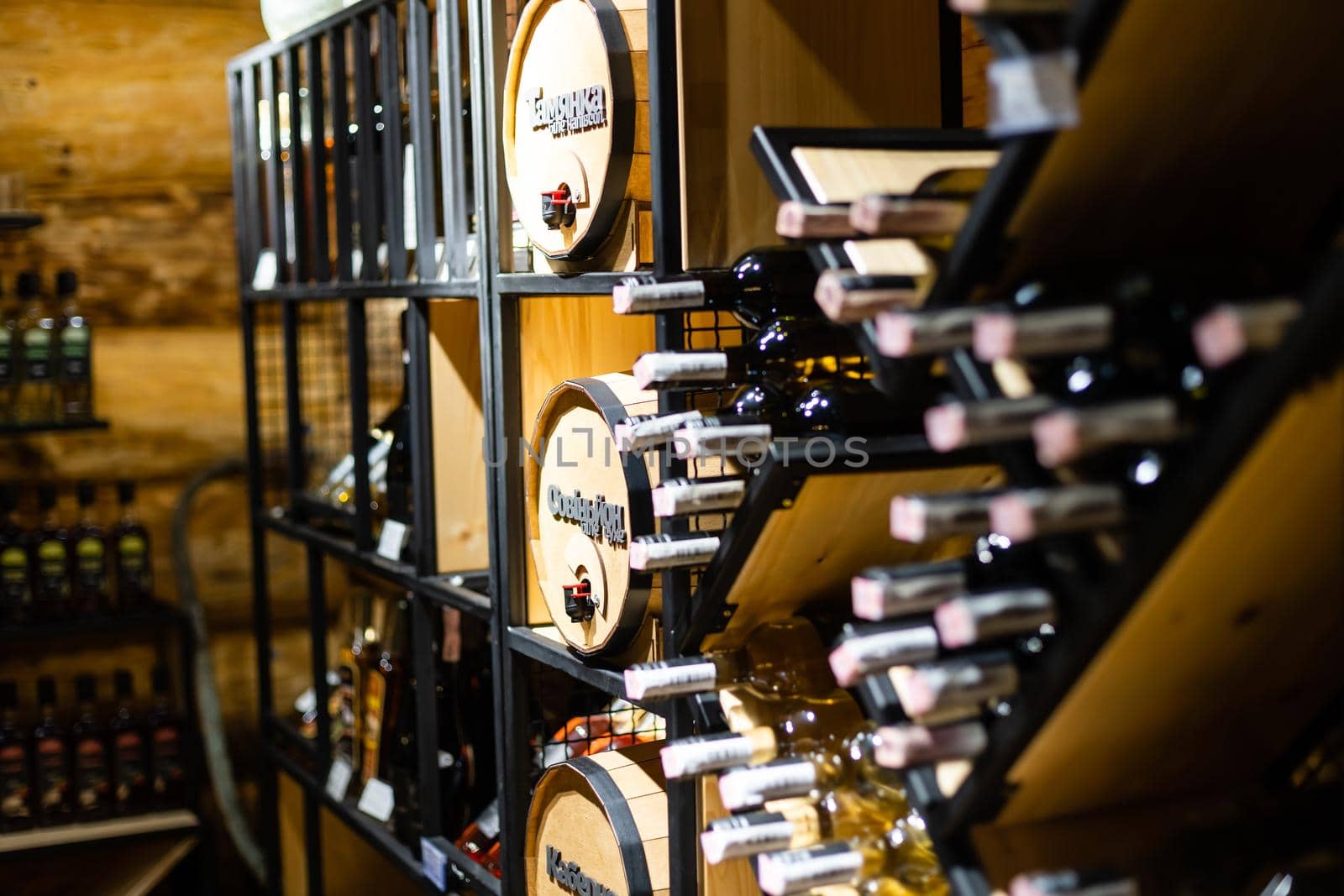 Interior of very old wine cellar with vintage wine pump and dried meat delicatessen