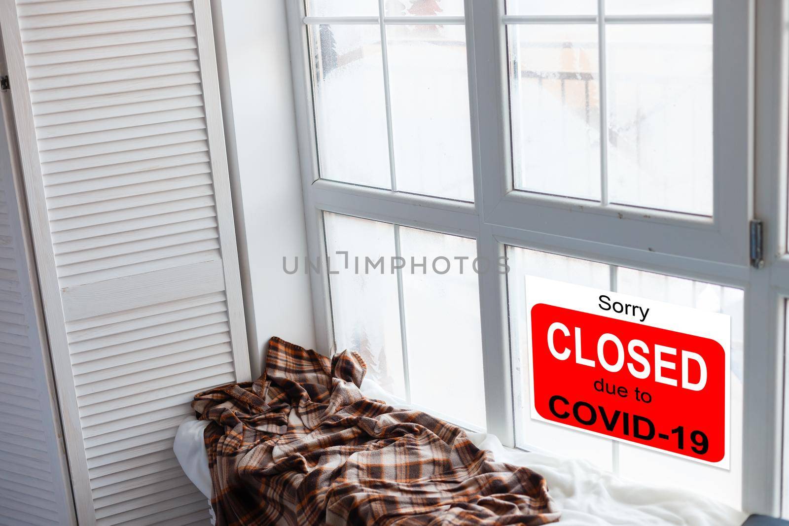 Business center closed due to COVID-19, sign with sorry in door window. Stores, restaurants, offices, other public places temporarily closed during coronavirus pandemic. Economy hit by corona virus.