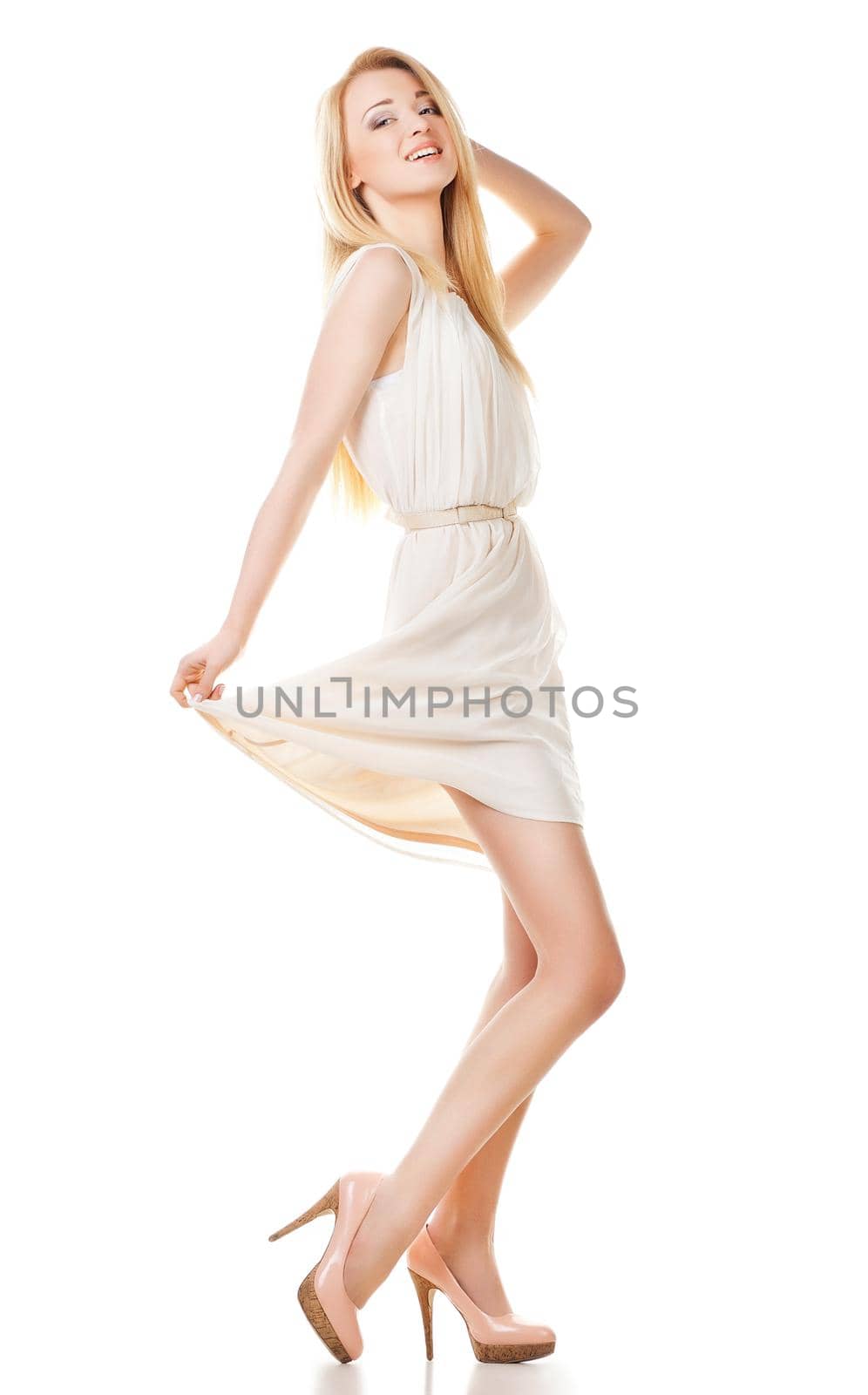 Portrait of beautyful smiling and posing blond woman with long hair on white background