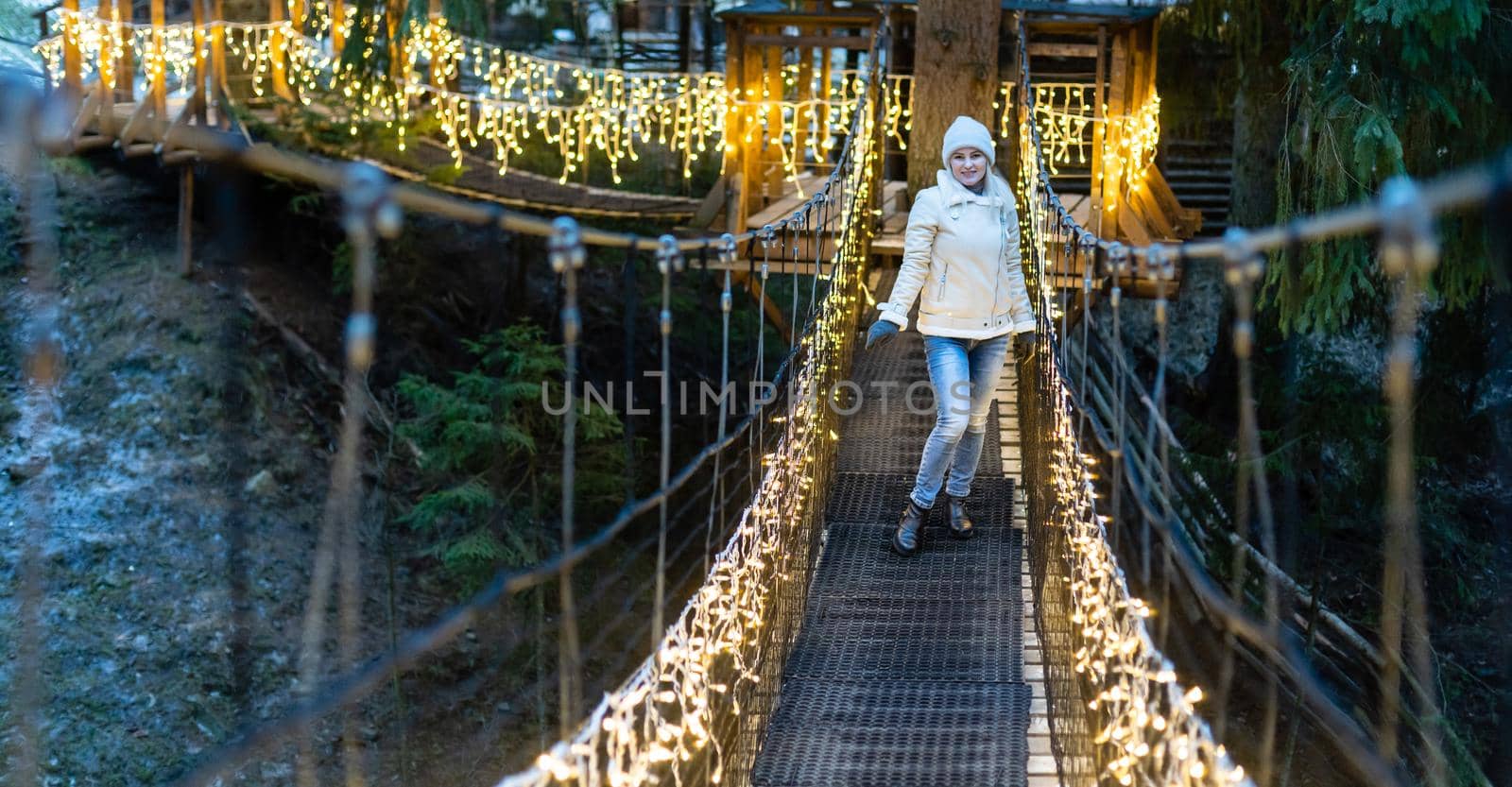 Portrait of happy young woman have fun at beautiful christmas evening.