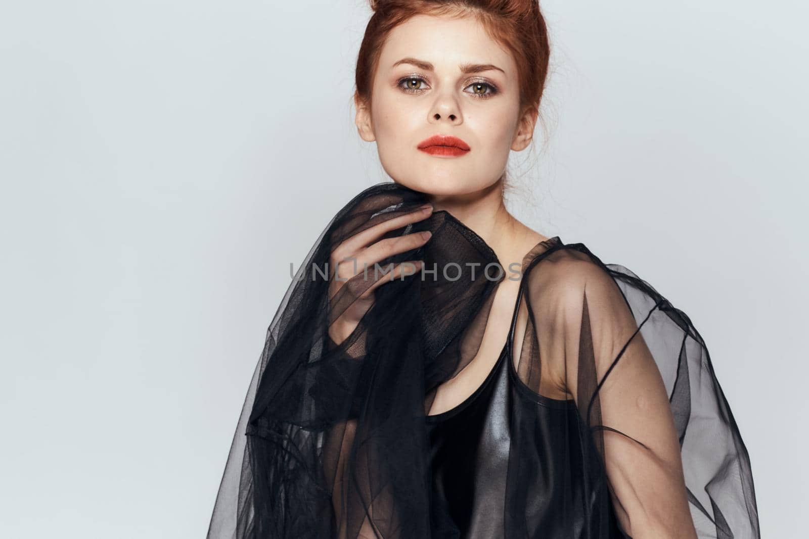 woman with black veil dress posing elegant style. High quality photo