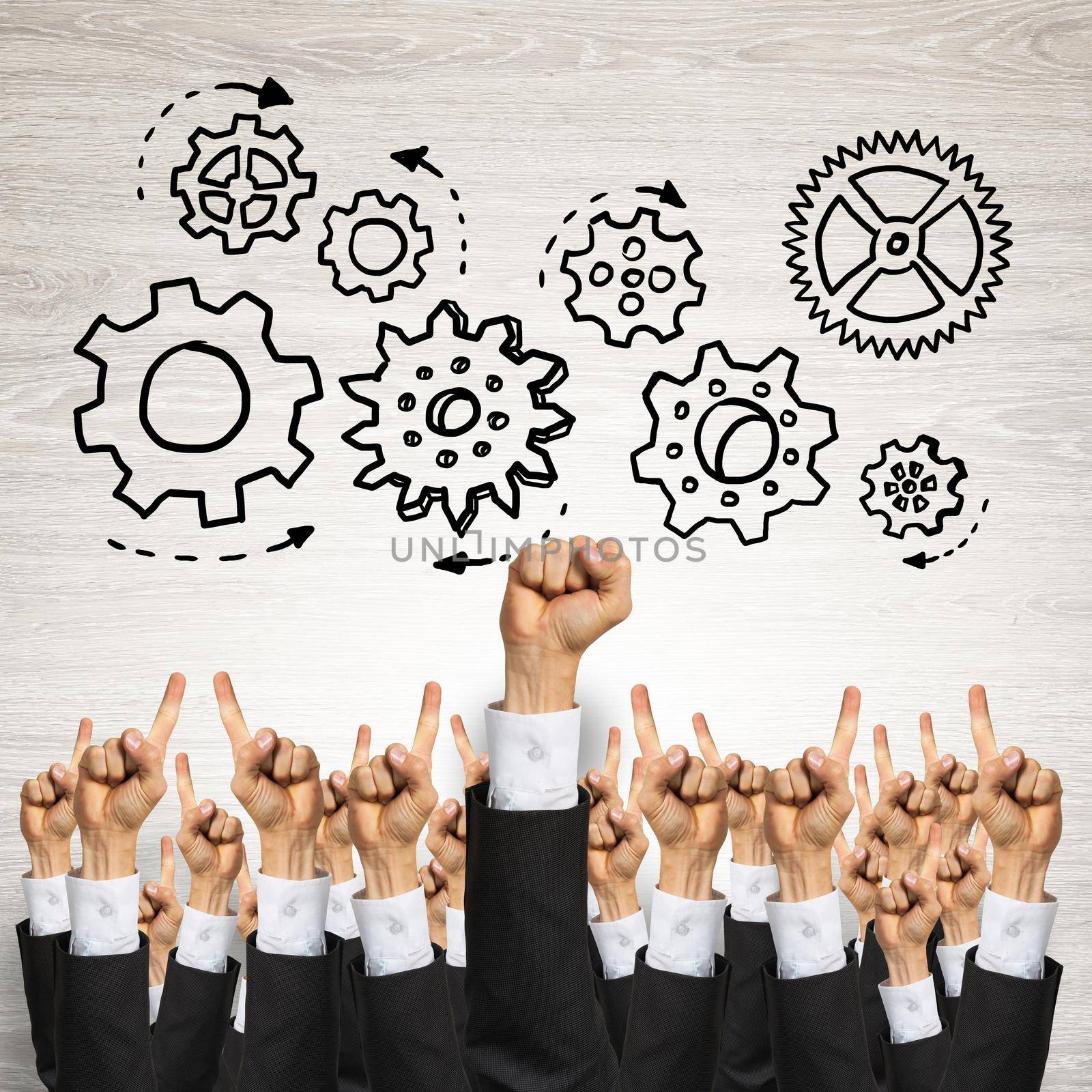 Group of hands of businesspeople showing gestures on wooden background