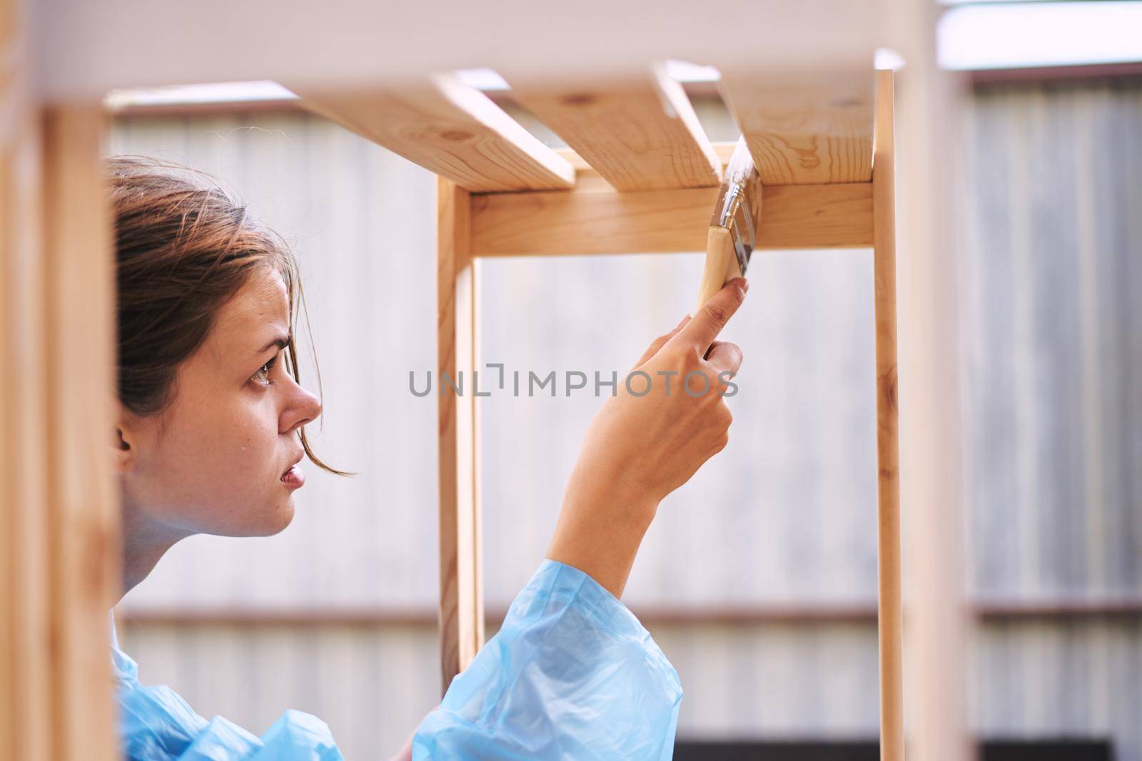 woman painter in protective clothing renovation design house. High quality photo