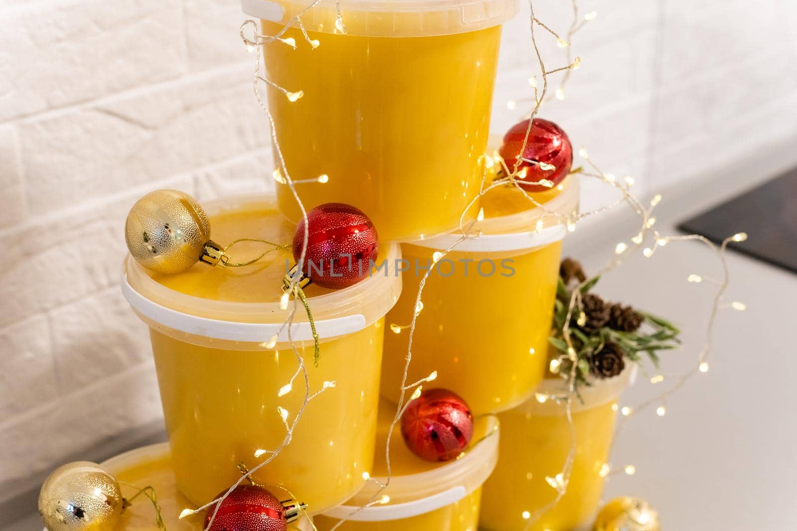 Christmas balls and jars of honey, New Year's spruce, golden balls.