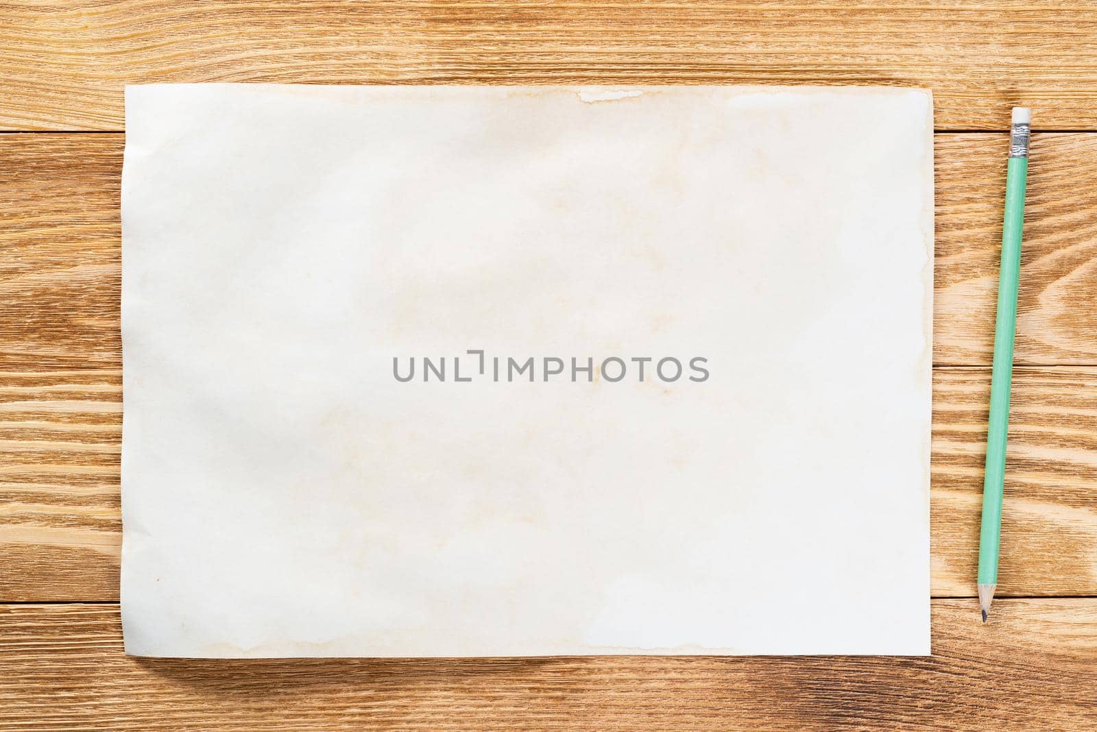 Sheet of paper lying on wooden table by adam121