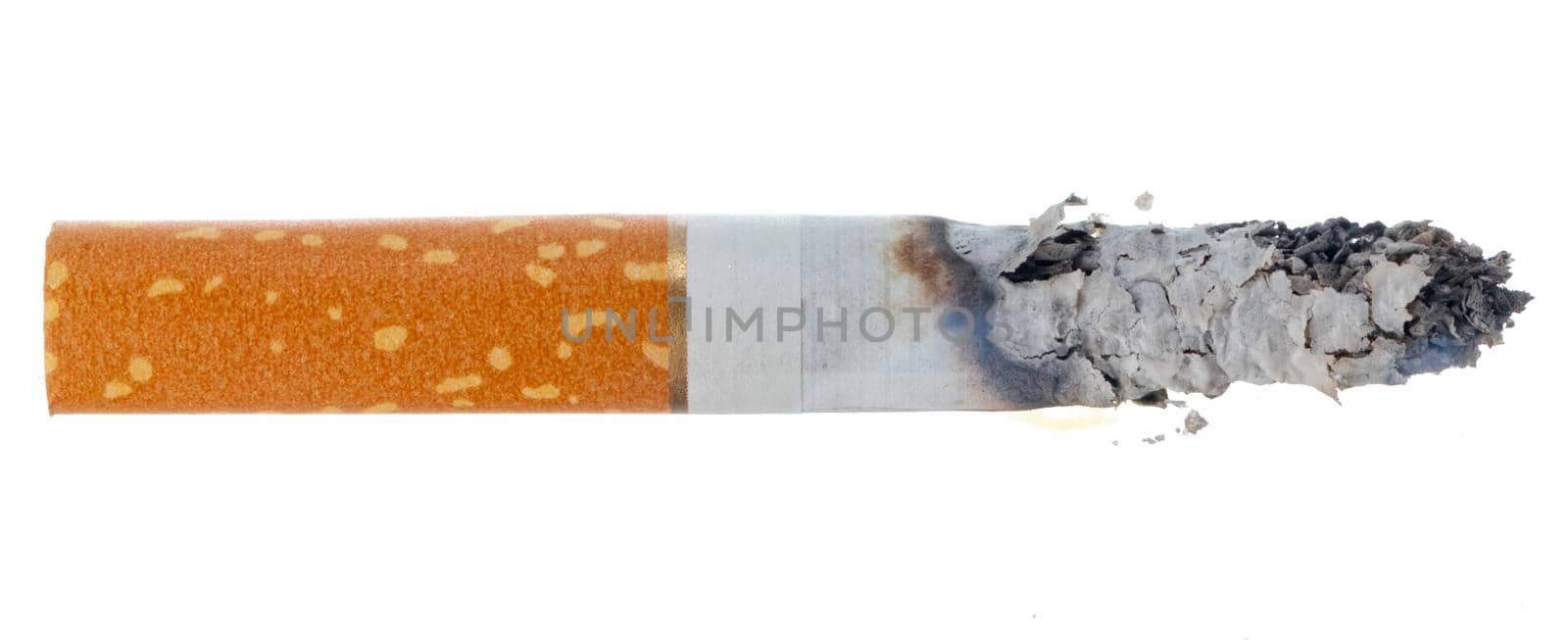 Lit cigarette isolated on white background close up top view