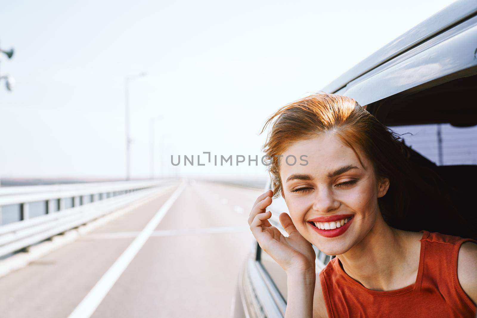 cheerful woman car ride road travel adventure. High quality photo