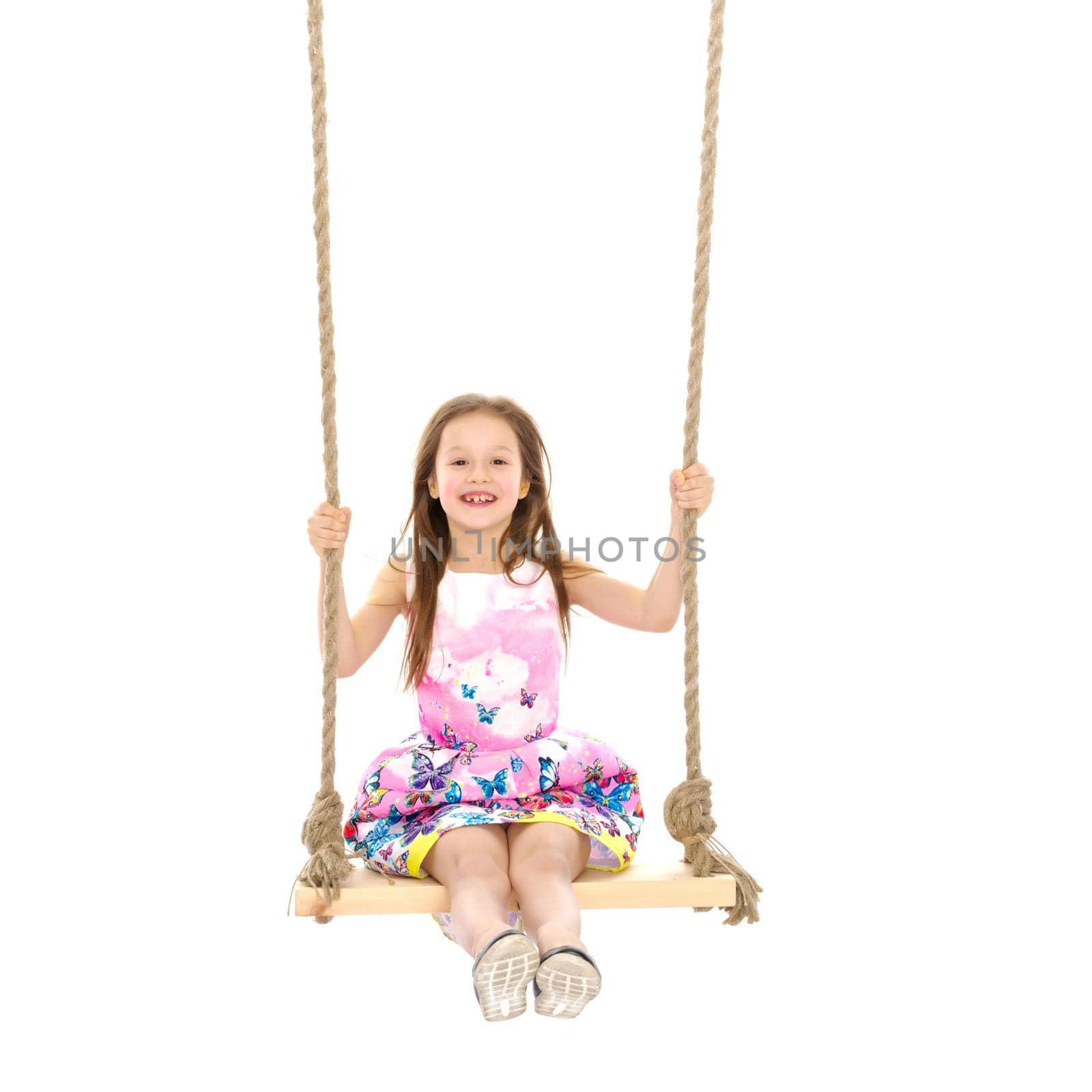 Little girl swinging on a swing by kolesnikov_studio