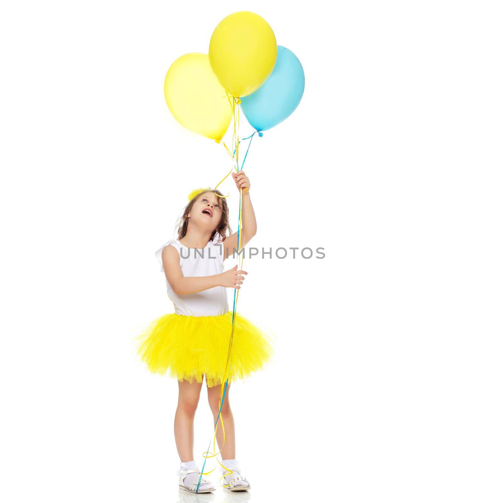The little girl is full-length. The concept of family happiness, a child, childhood, play, beauty and fashion. isolated on white background
