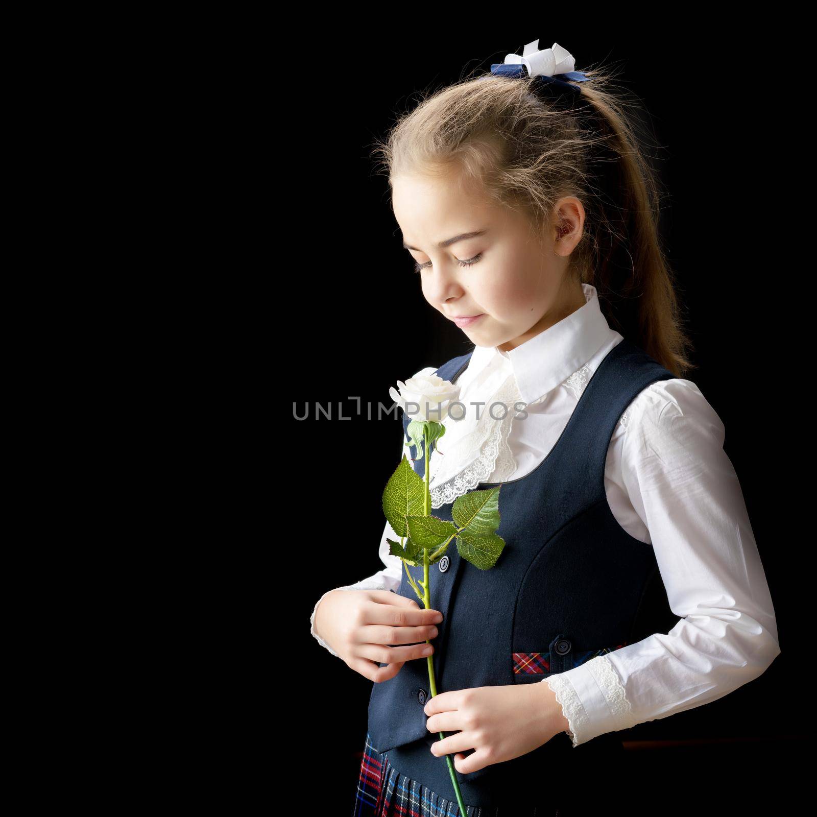 Little girl with a flower in her hand. by kolesnikov_studio