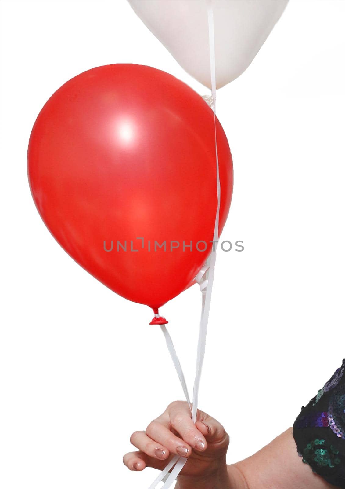 The woman's hand holds 2 balloons on a rope red and light color on a white background, isolated.