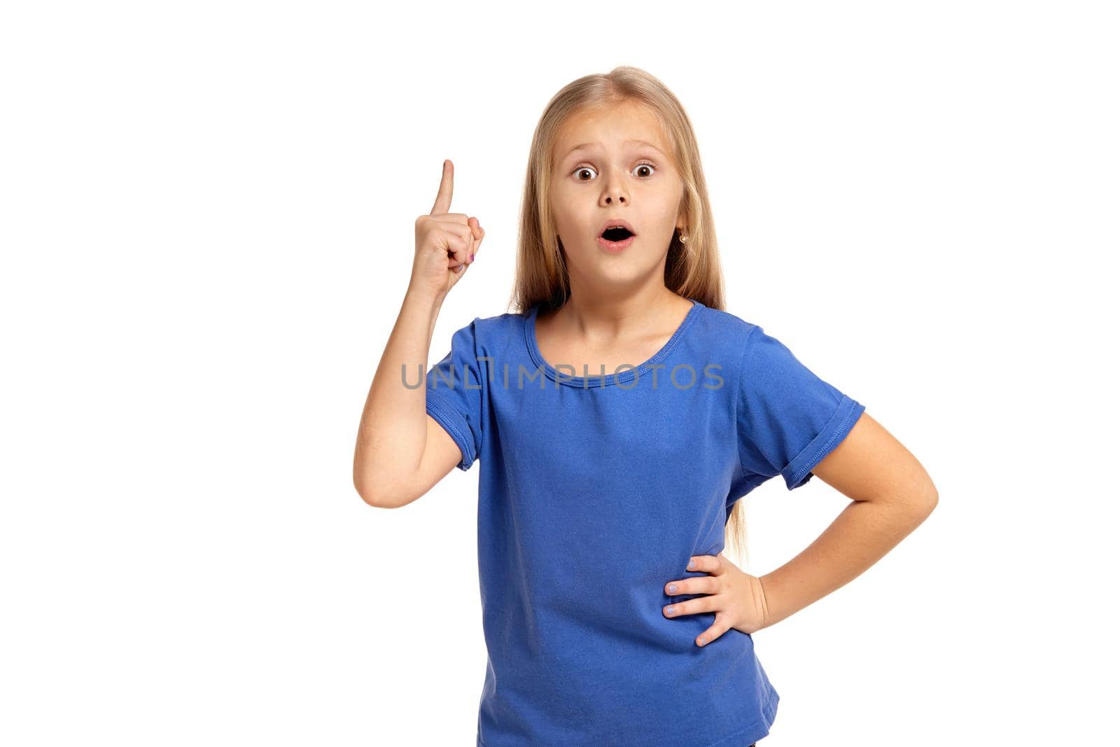 Portrait of adorable little girl isolated on a white background. in blue t-short with long white hair, pointing with finger, found solution