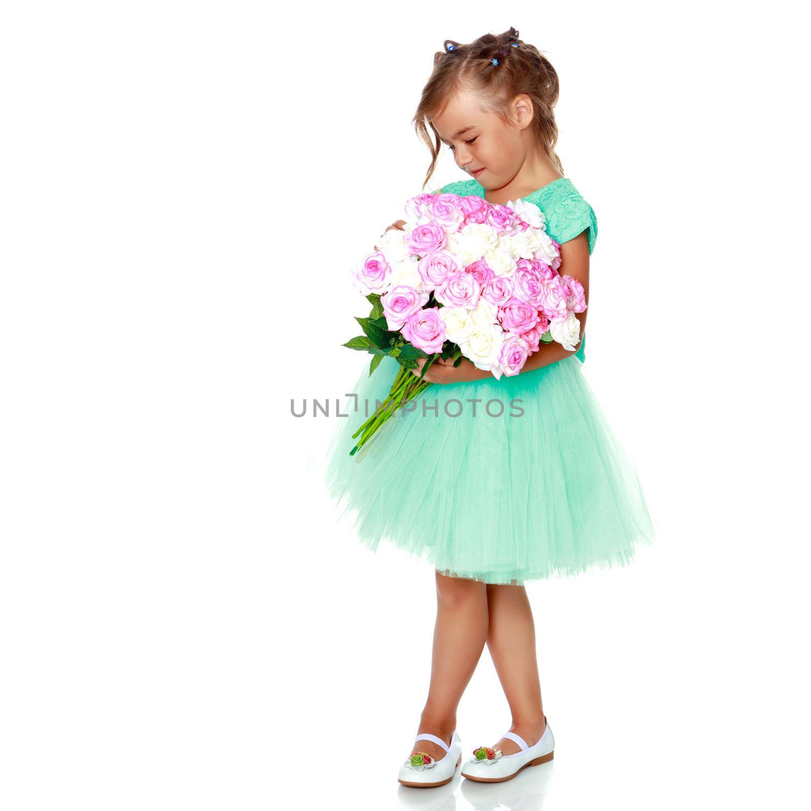 Little girl with a bouquet of flowers by kolesnikov_studio
