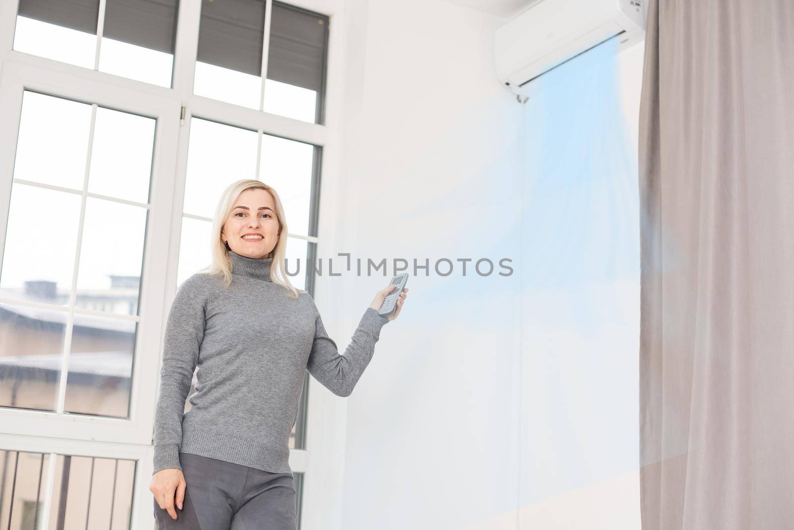 Hand of woman includes air-conditioner.