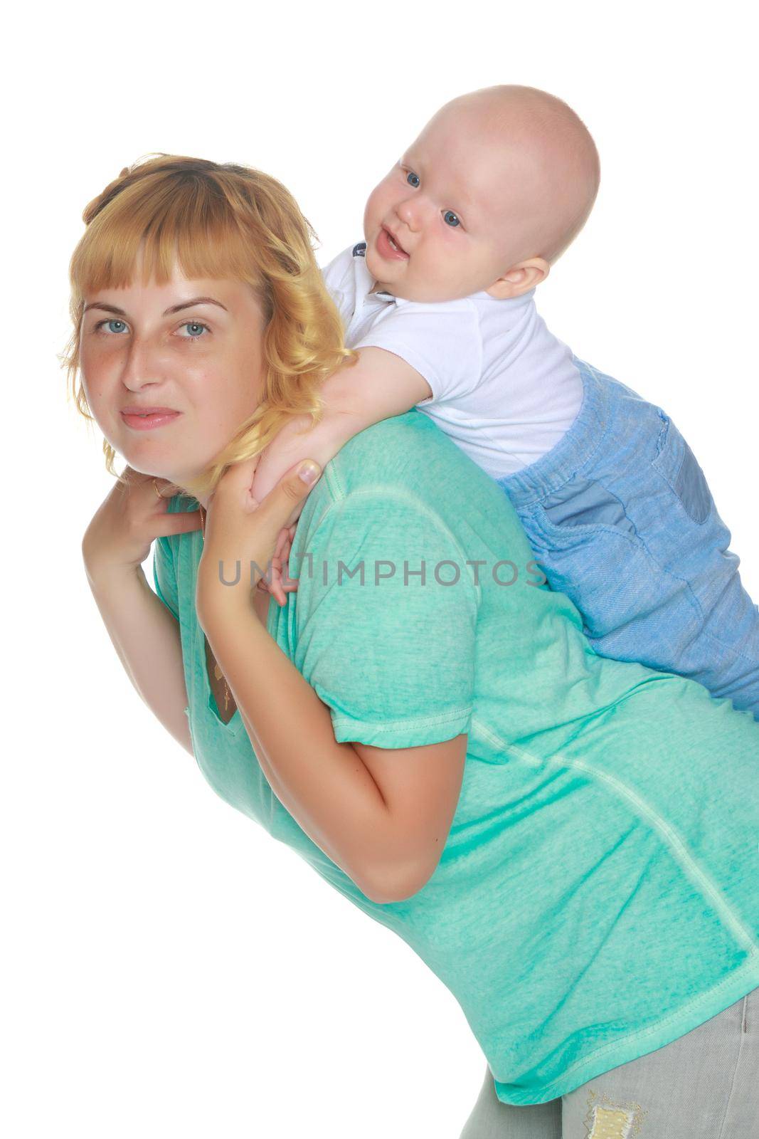 Mom holds on the shoulders of the baby. The concept of happy motherhood, family happiness, child development. Isolated on white background.