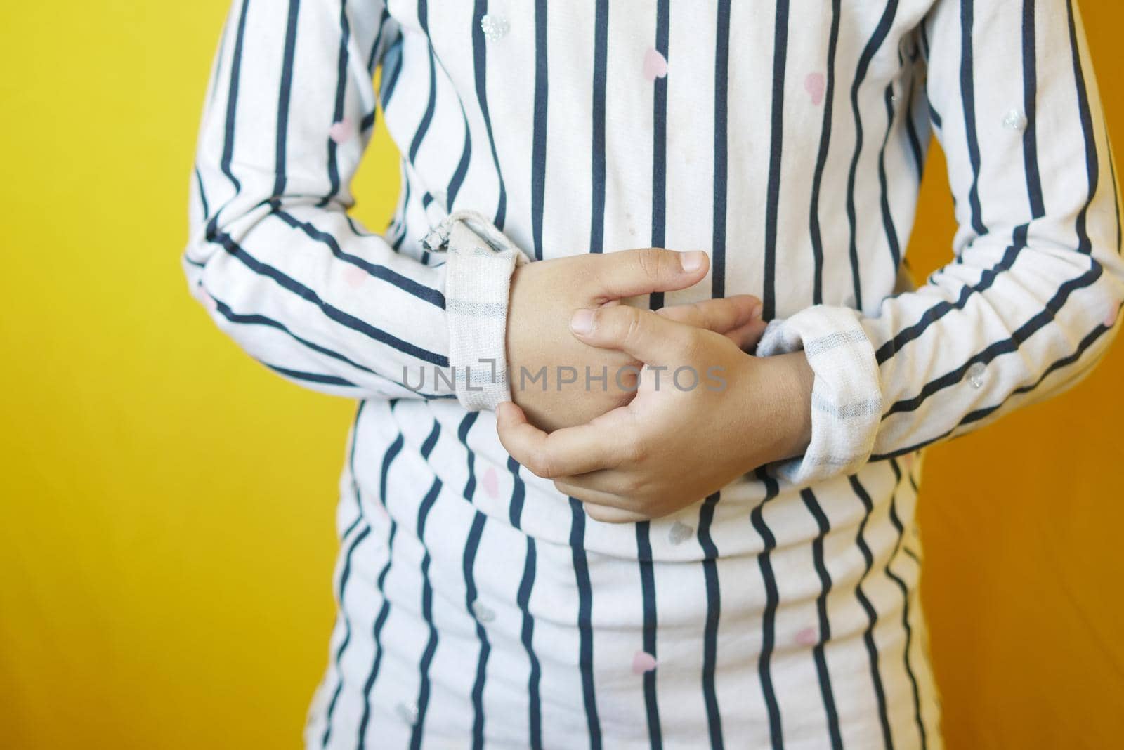 child girl suffering stomach pain close up