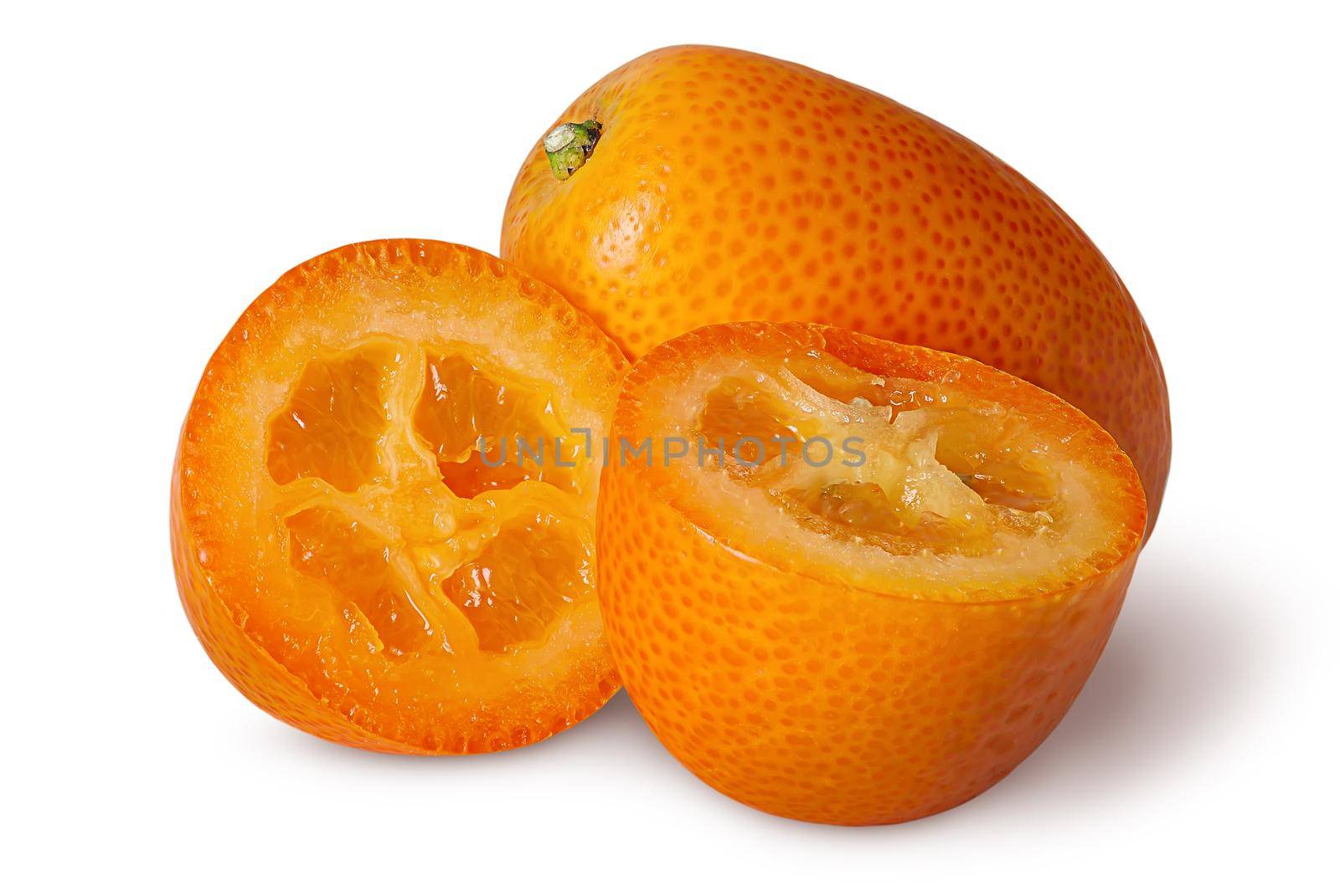 Halves and whole ripe kumquat isolated on white background