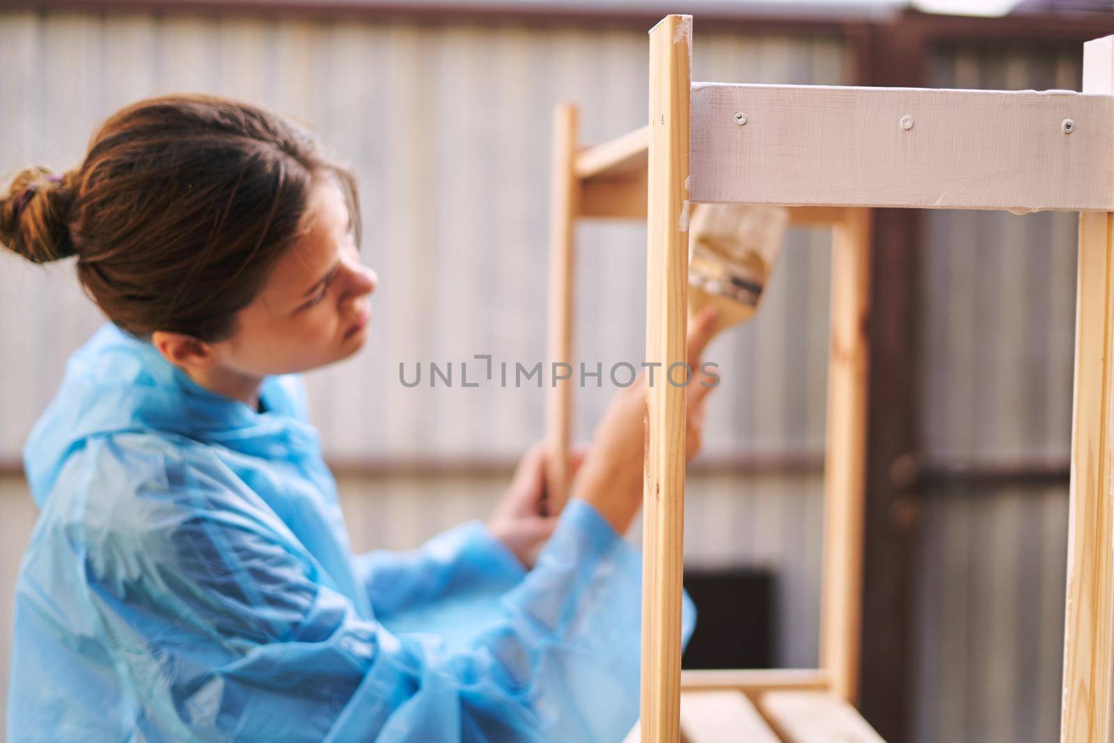 woman painter in protective clothing renovation design house. High quality photo