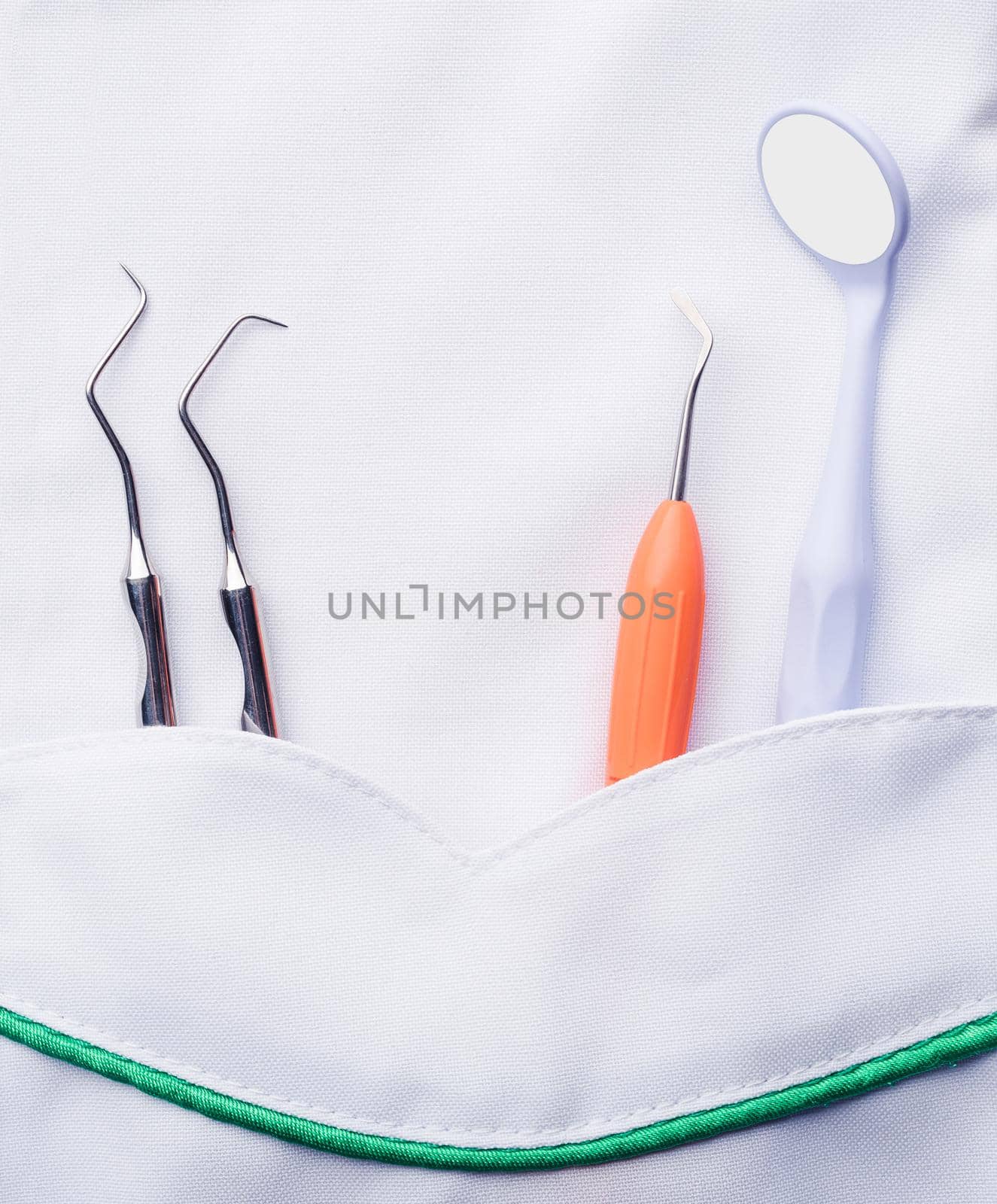 Closeup of dental tools in pocket by GekaSkr