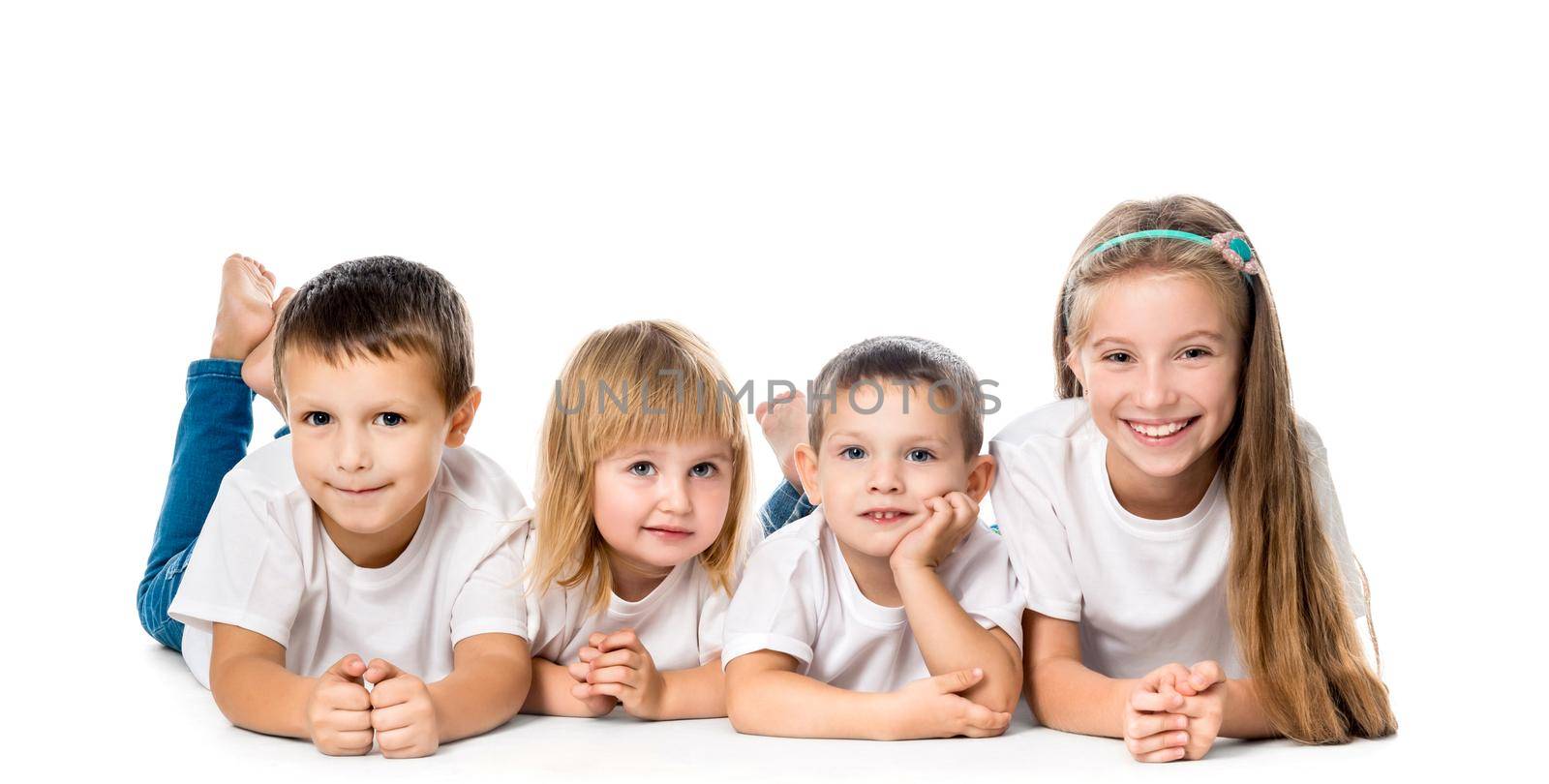 smiling children lying on the floor isolated on white background