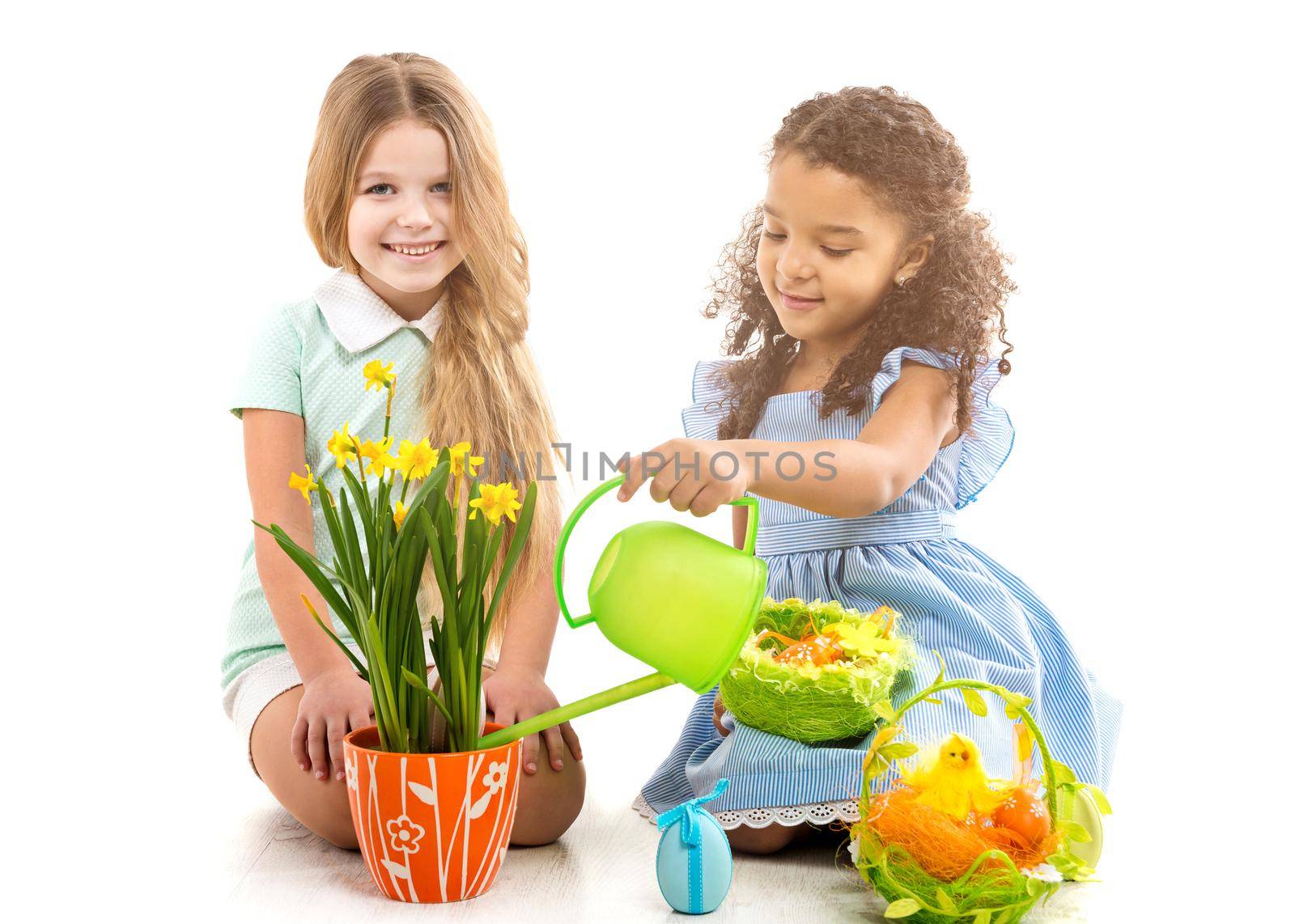 two little girls watering flowers and playing on the floor by tan4ikk1