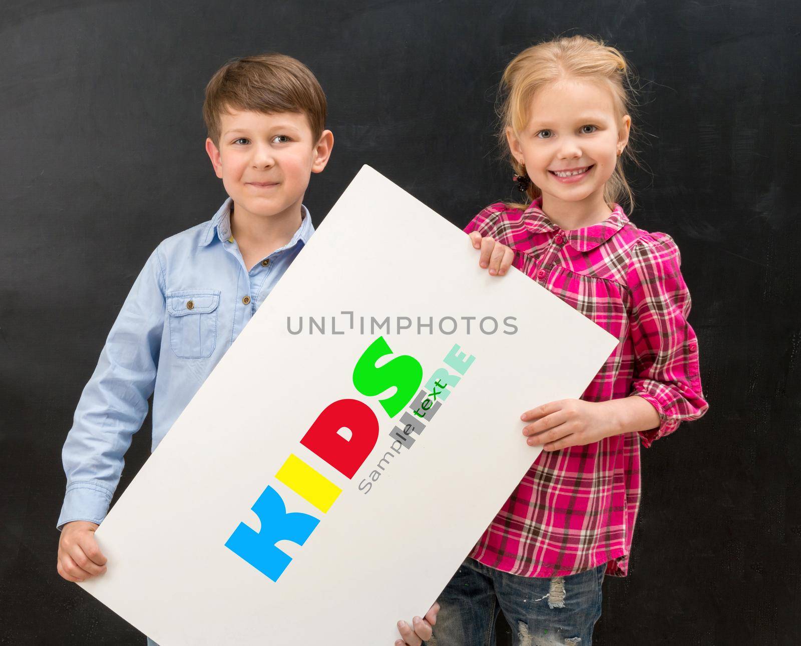 two smiling schoolchildren with blank sheet of paper by tan4ikk1