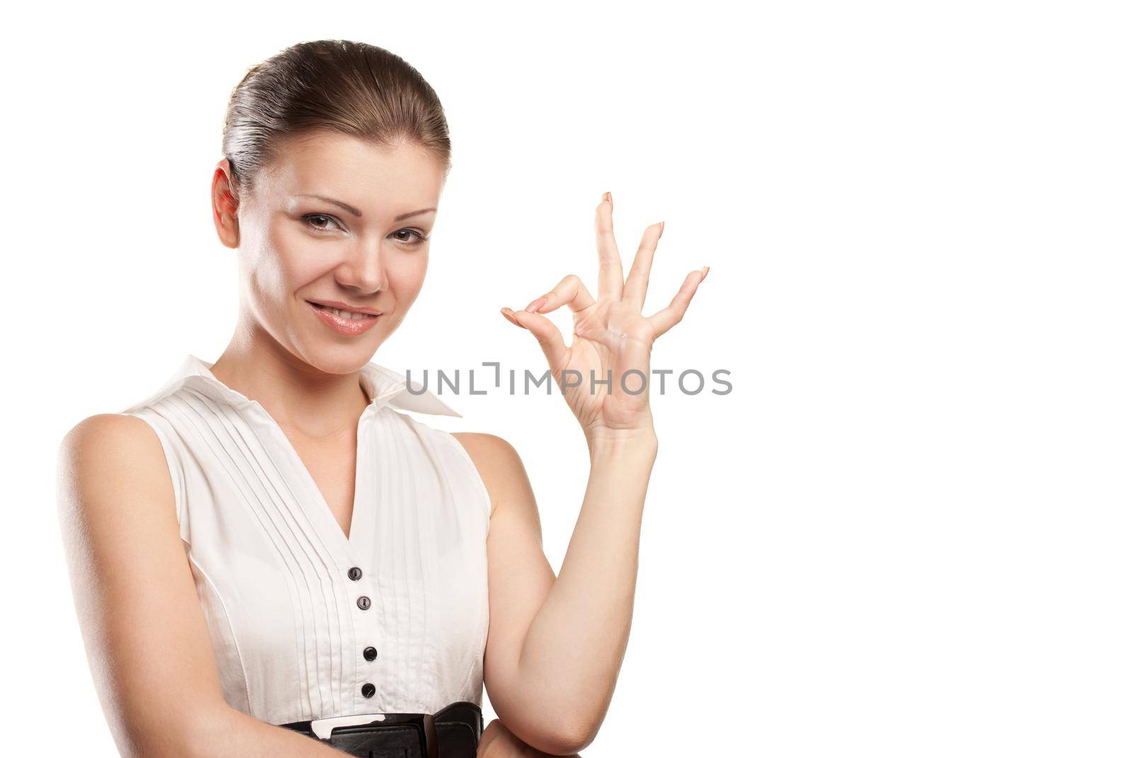 Beautiful young woman signaling ok. Isolated over white background