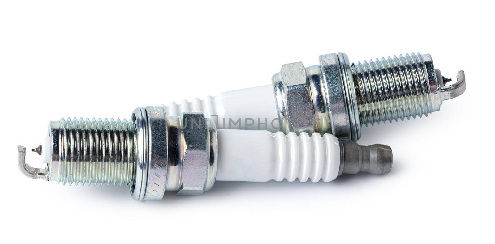 Car part. Spark plugs isolated on white. Close up.