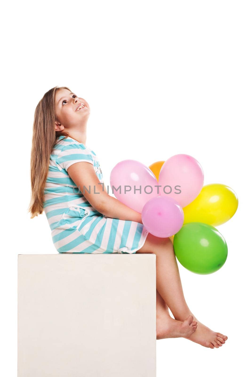 Happy girl with balloons on a white background