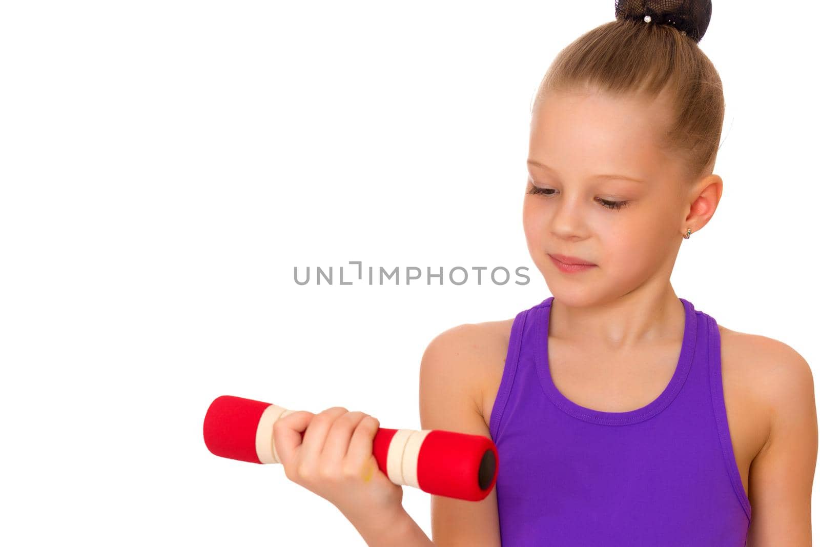 A cute little girl doing exercises with dumbbells. The concept of strength, health and sport. Isolated on white background.