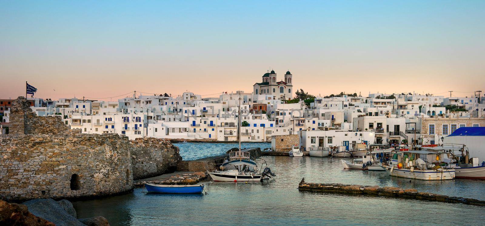 old port in the village on the island of Paros at sunset. Greece