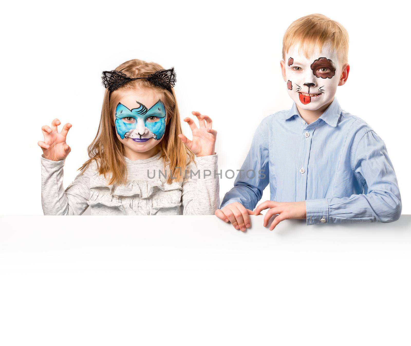 Boy and girl with face art on white background by tan4ikk1