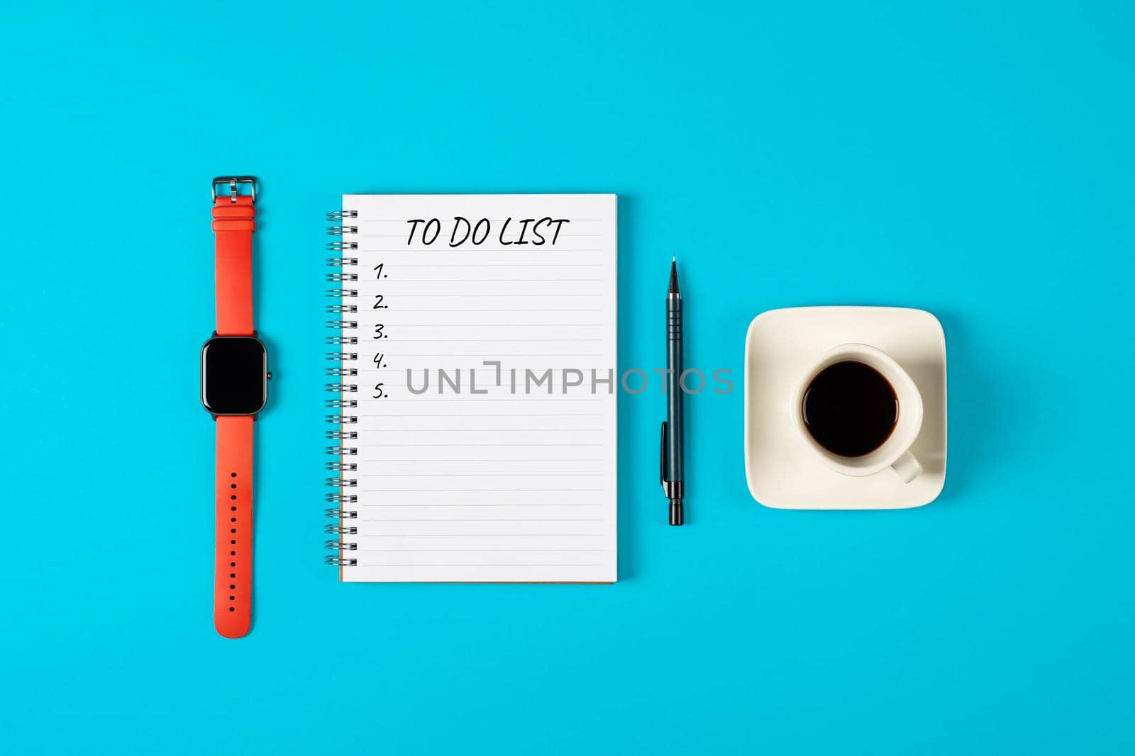 To do list banner. A cup of black coffee, watch, pencil and modern notebook isolated on blue background from above. Planning and design concept. Top view, flat lay, copy space.