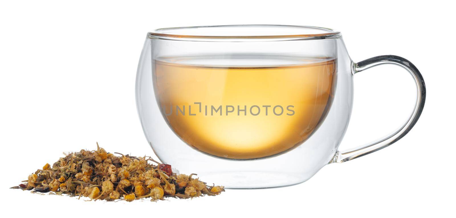 Glass cup of tea with dry tea leaves isolated on white background