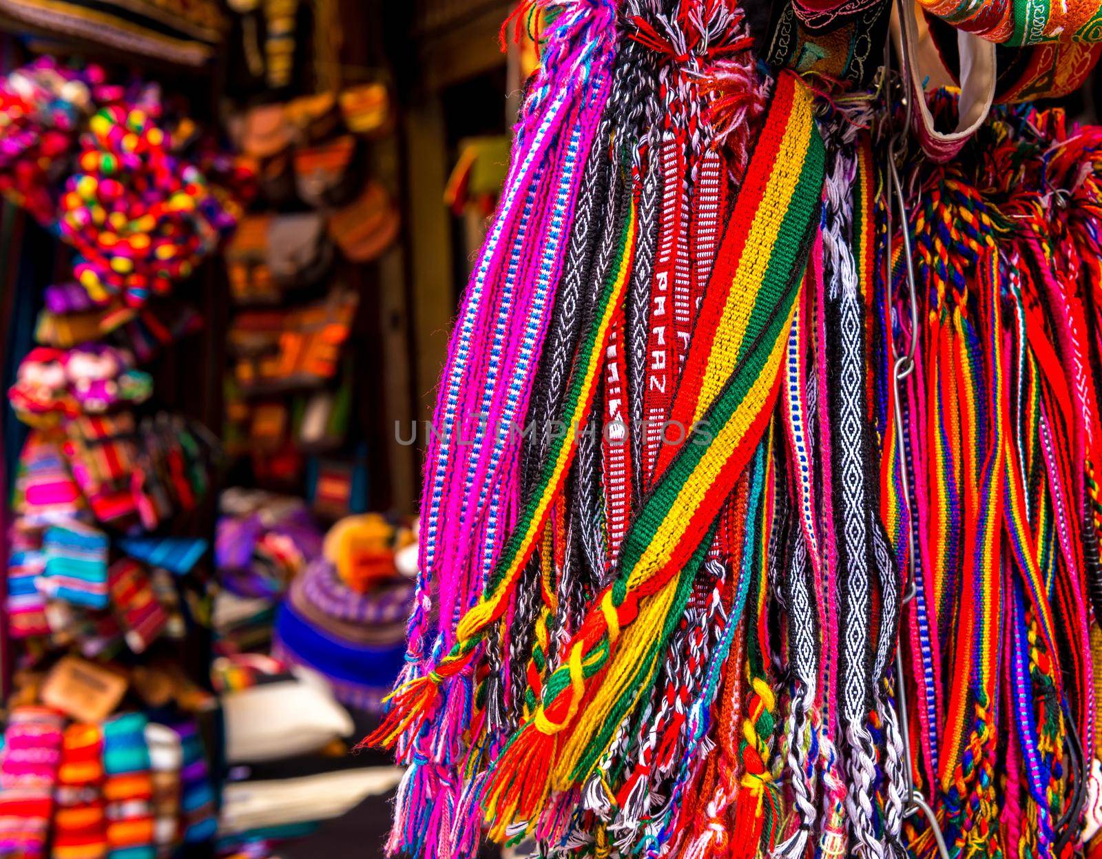 Different colorful laces with patterns hanging on the souvenir store in Bolivia