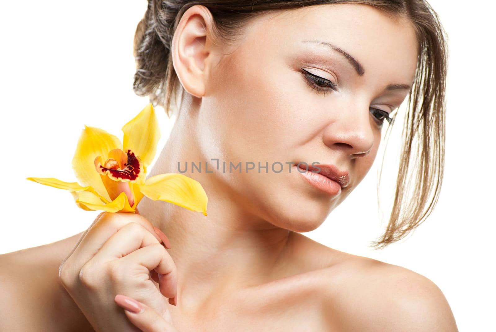Portrait of young beautiful woman on white background with flower
