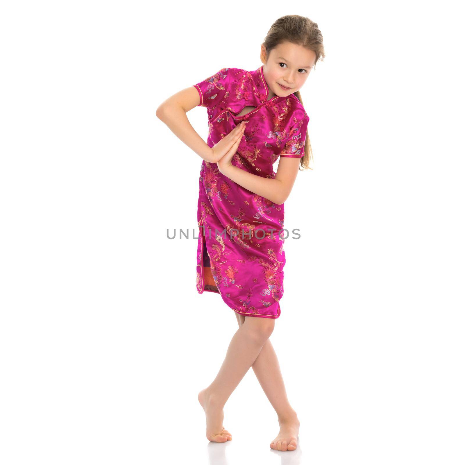 Little girl in Chinese national dress. The concept of style and fashion, the costumes of the peoples of the world. Isolated on white background.