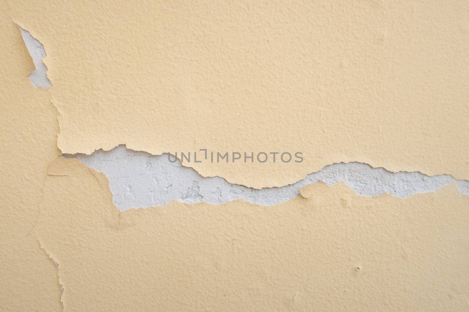 Texture as an element of design, peeling old paint on a concrete wall. Background for the design of any printed product.