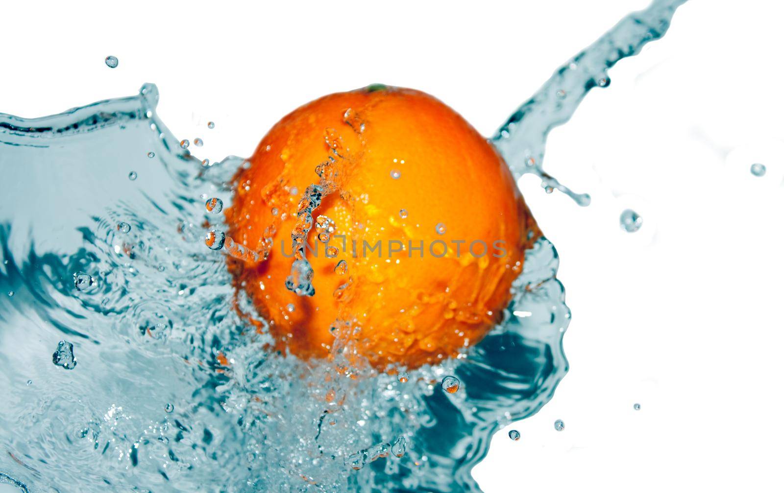 photo of water splash on half of orange