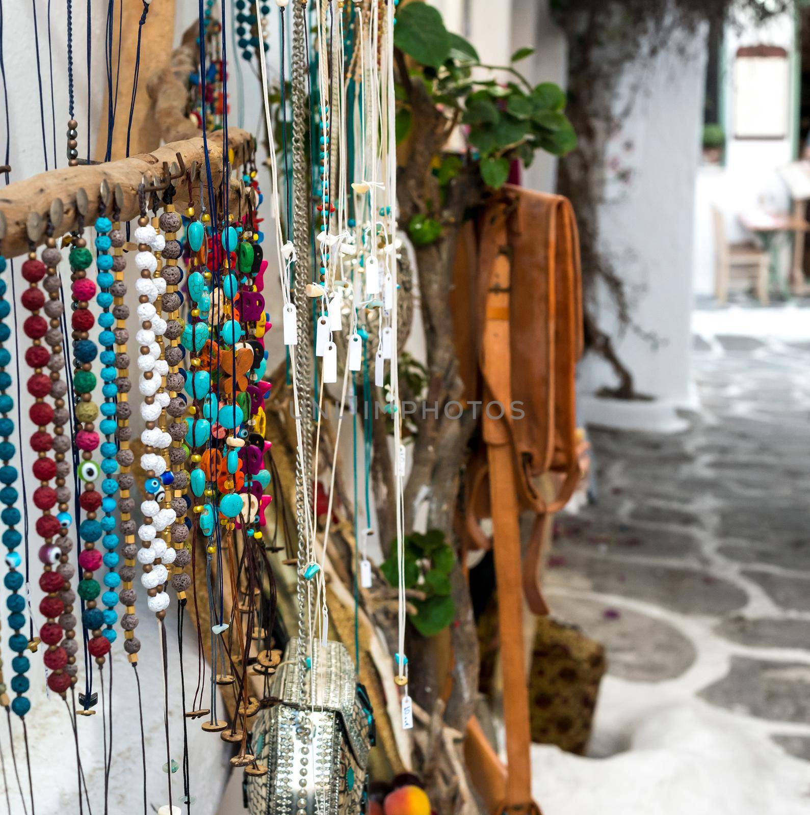 Colorful vintage jewelry necklaces and accessories at the street souvenir market in Greece