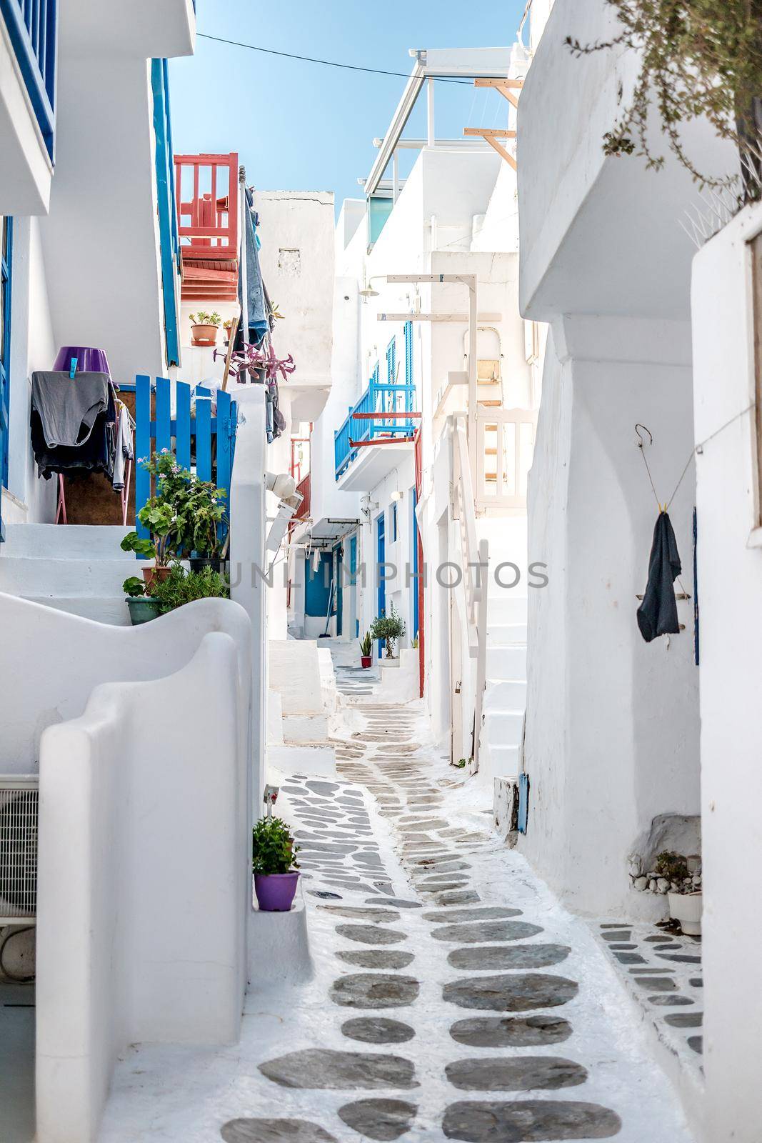 Narrow street with white houses, Greece by tan4ikk1
