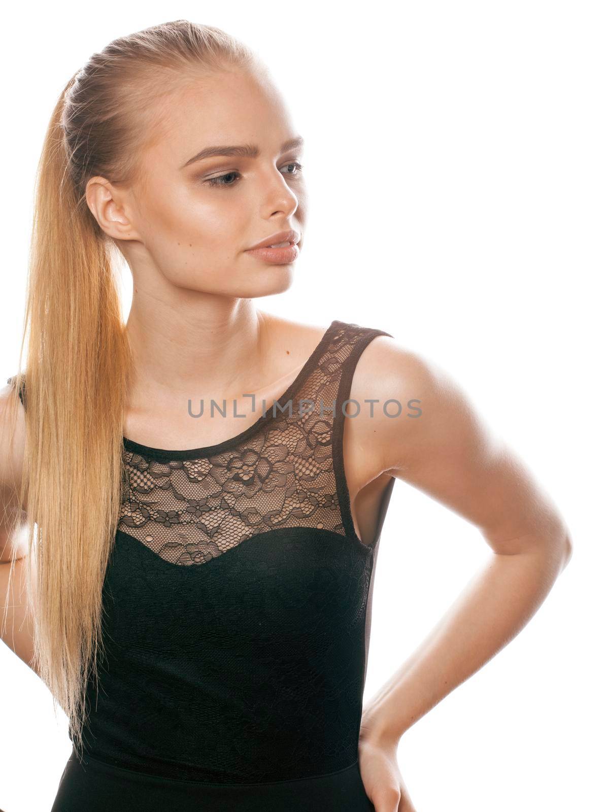 beautiful blond woman dressed elegant posing in the studio on white background isolated