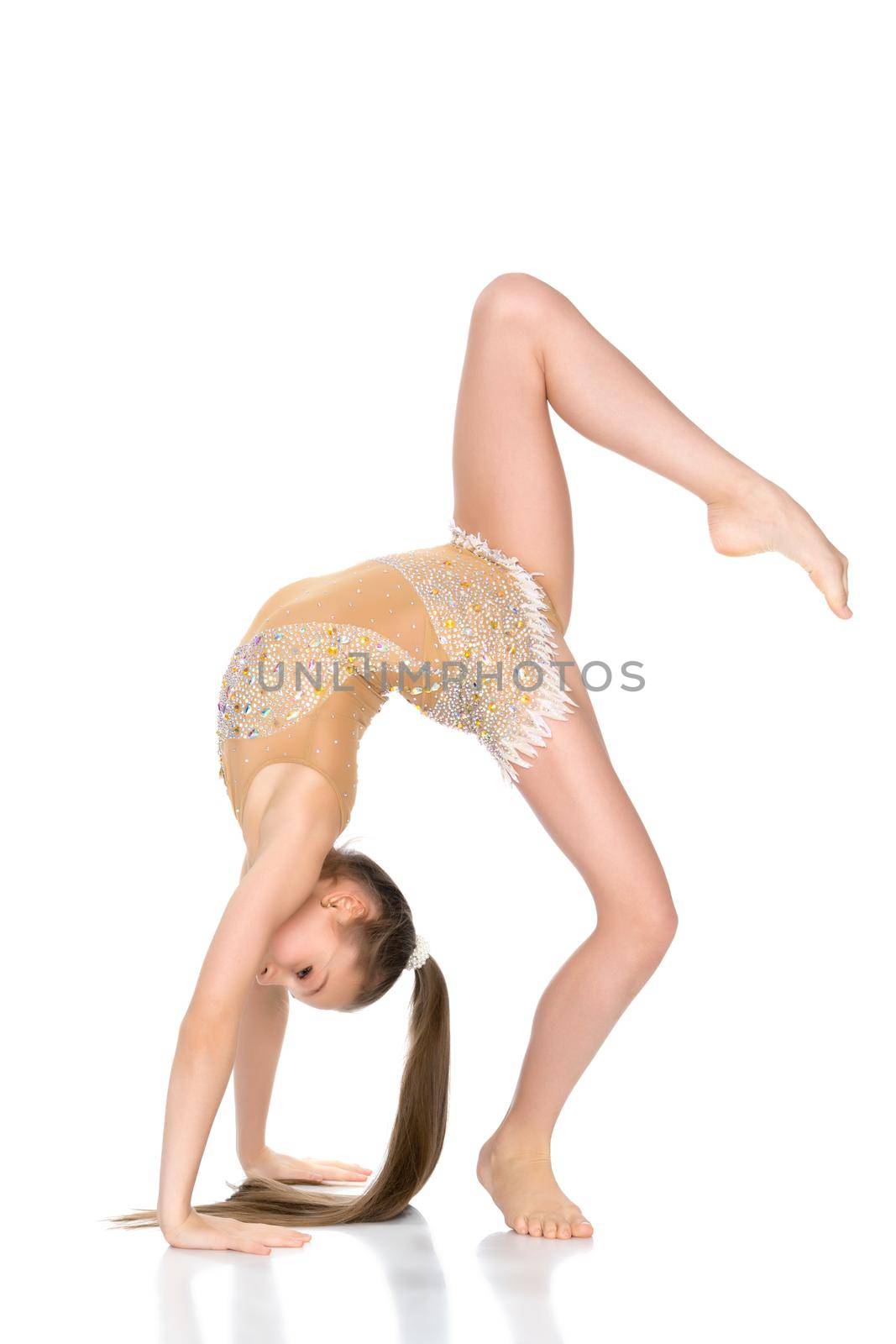 Girl gymnast performs a bridge with a raised leg. The concept of a healthy lifestyle, sport. Isolated on white background.
