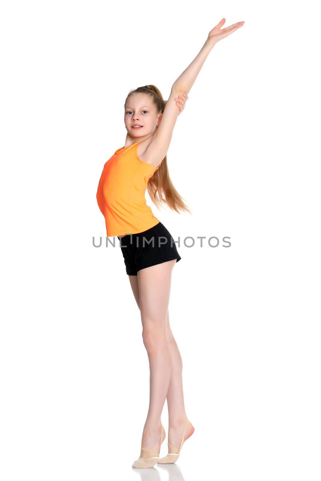 A teenage girl is engaged in fitness. She performs various exercises. The concept of childhood, sport, a healthy lifestyle, physical development of personality. Isolated on white background.