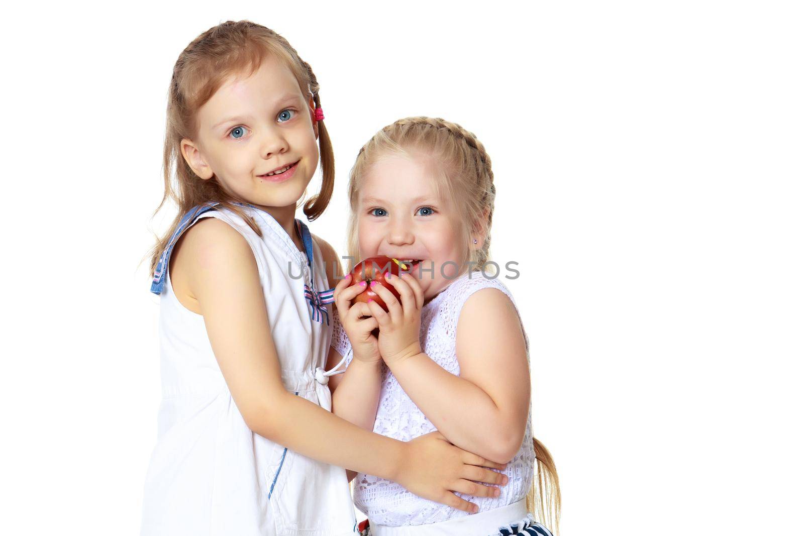 two little girls with an apple by kolesnikov_studio