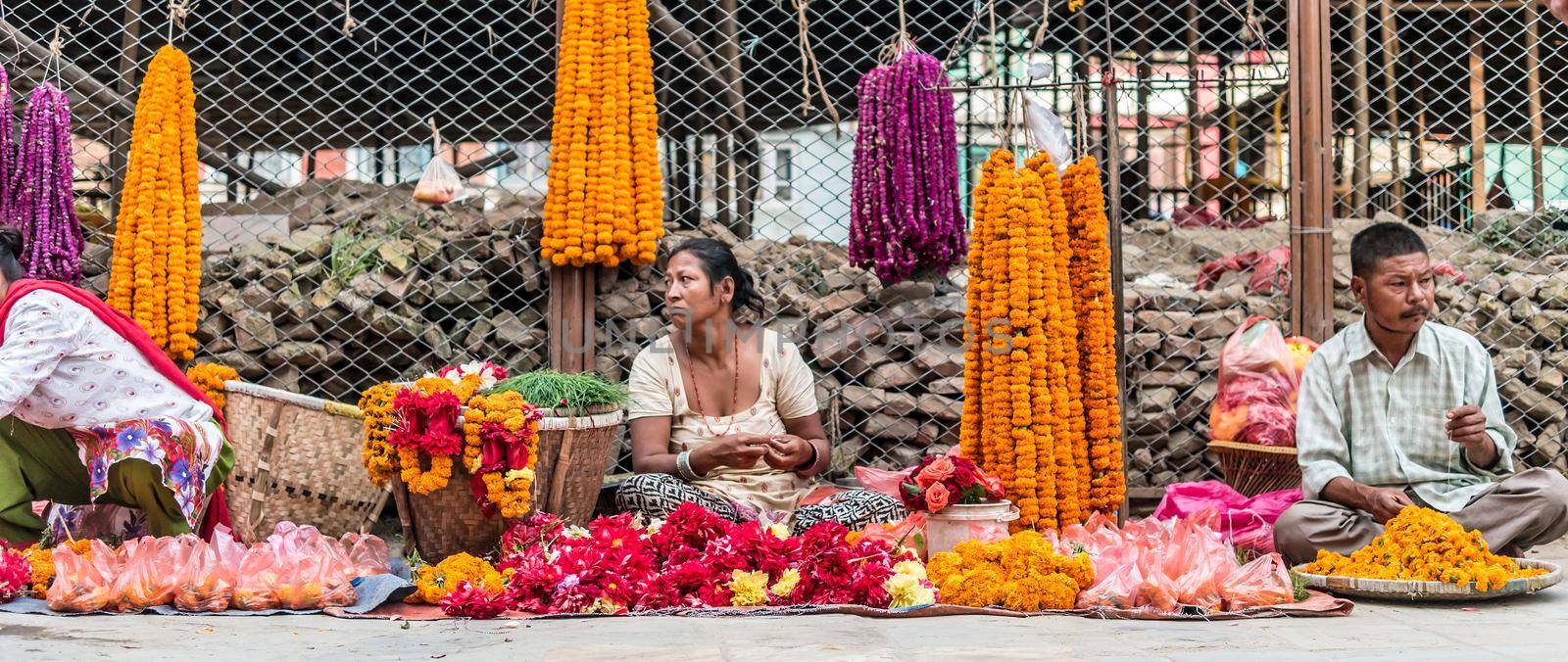 KATHMANDU, - OCTOBER 05: People sell flower necklaces near to Kathmandu Durbar Square in Kathmandu, Nepal, October 05, 2017