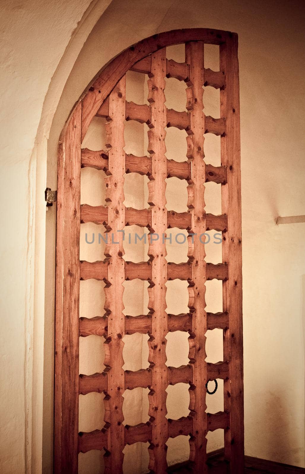 old wooden grid gate with vintage sepia look
