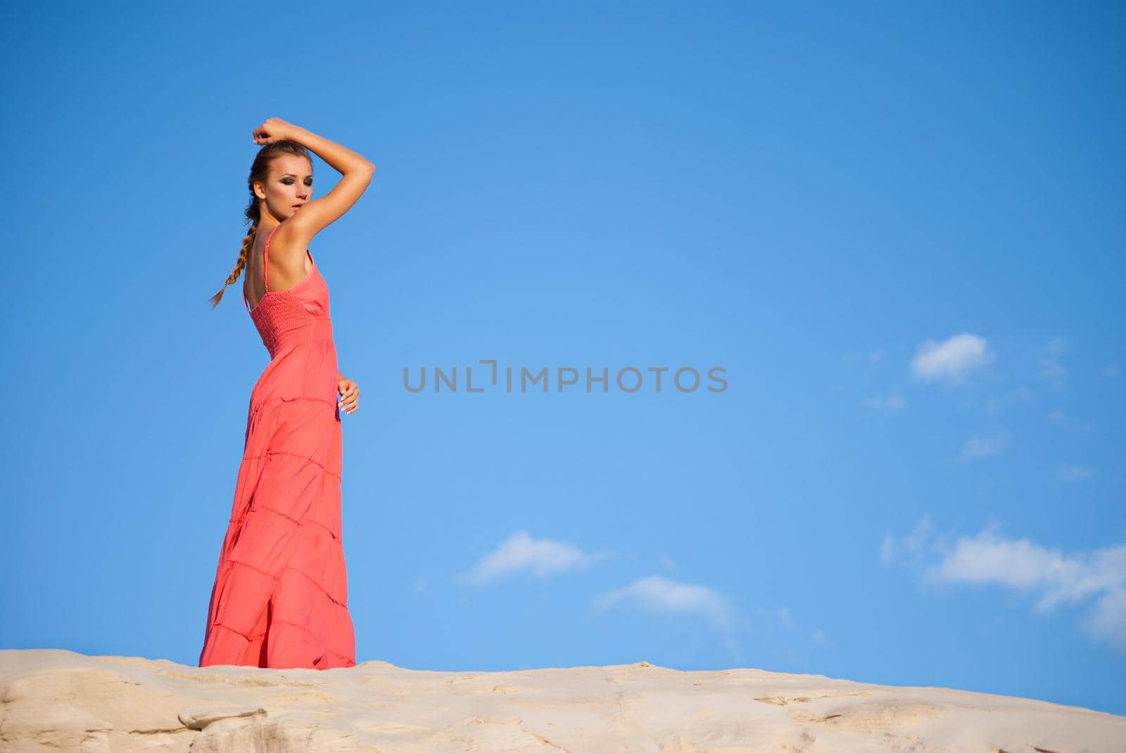 beauty woman in red dress on the desert by Julenochek