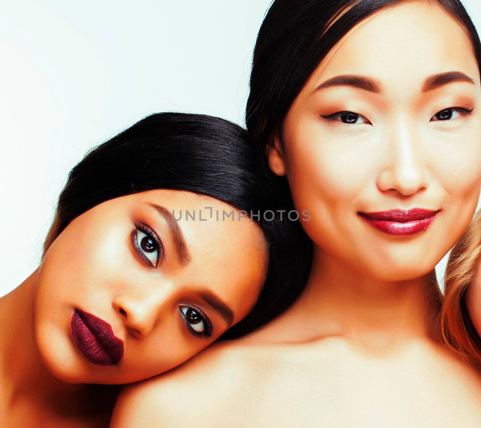 different nation woman: african-american and asian together isolated on white background happy smiling, diverse type on skin, lifestyle people concept by JordanJ