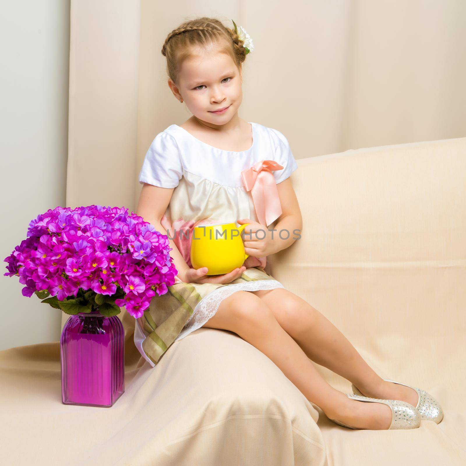 Little girl with a bouquet of flowers by kolesnikov_studio